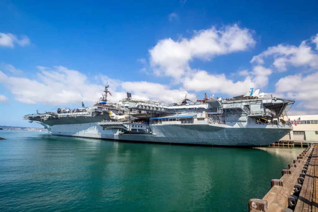USS Midway Museum aircraft carrier docked in San Diego bay under a blue sky
