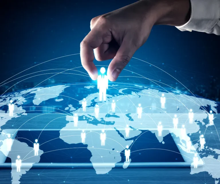 Hand selecting a person icon from a global network of people icons on a digital map