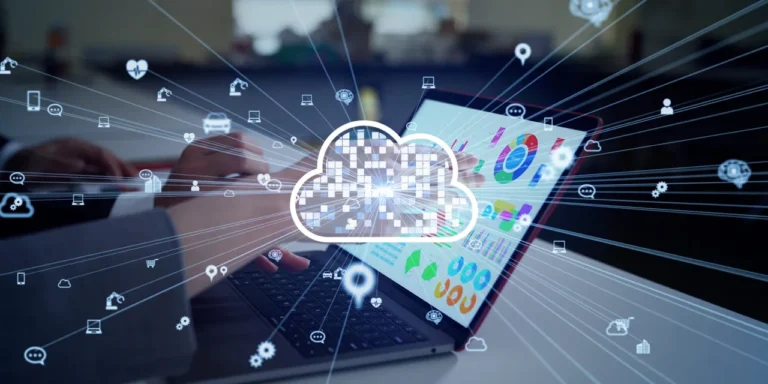 A person uses a laptop displaying charts and data related to SylogistMission CRM built on Microsoft Dynamics 365